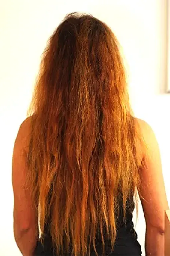 Before: curly, voluminous hair
